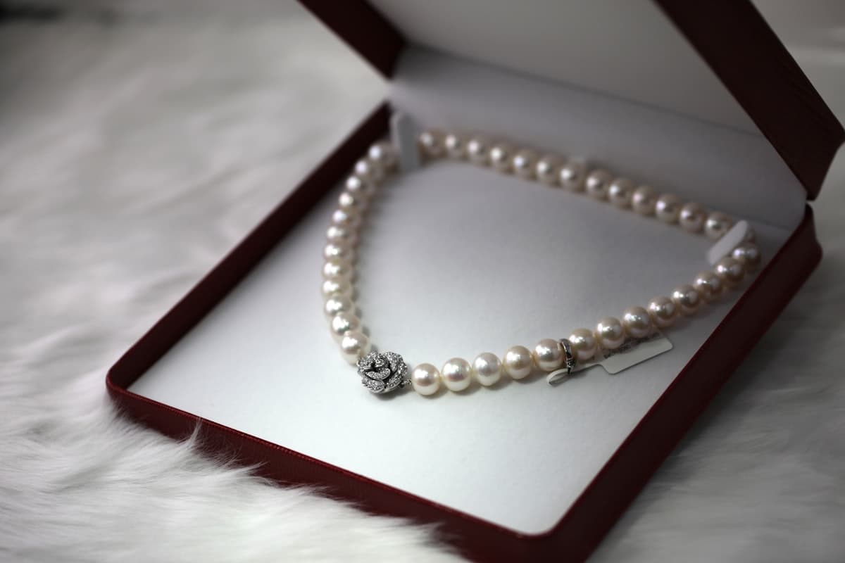 Gold jewelry arranged on a neutral surface
