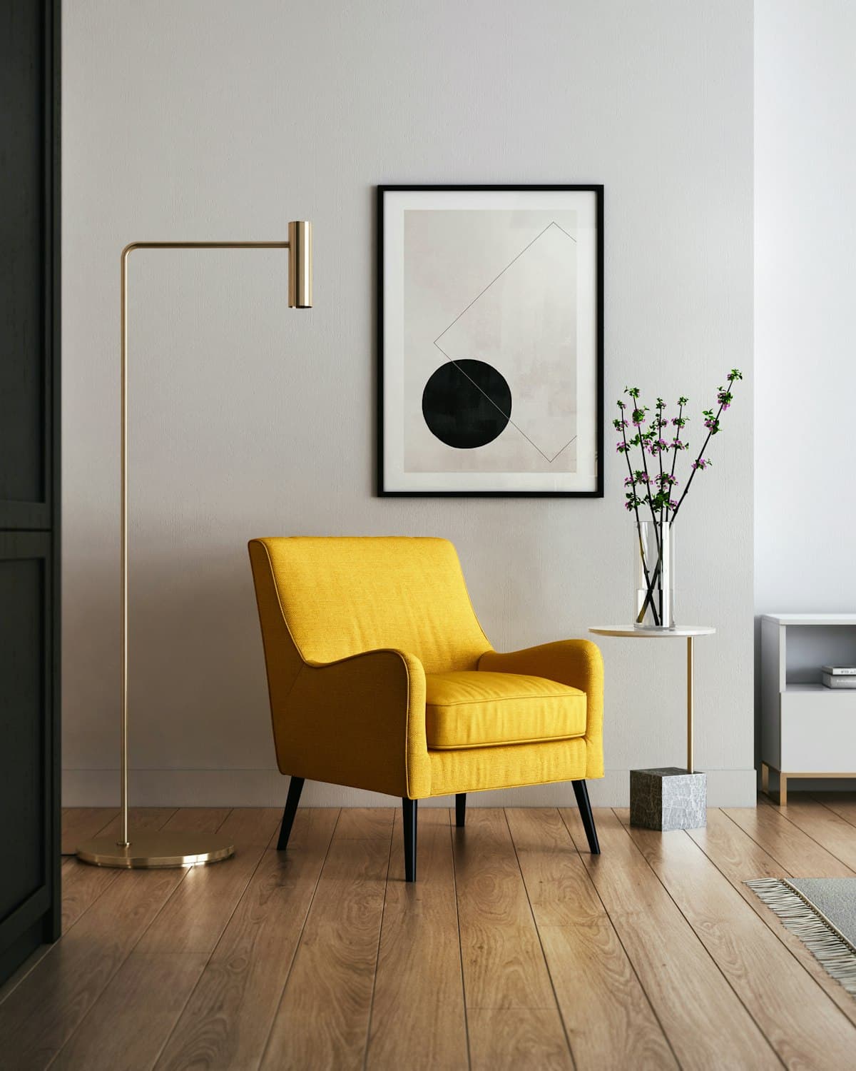 Mustard armchair with gold lamp and marble side table in a living room